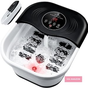 Electric foot spa bath massager with digital display, filled with water and bubbling, featuring multiple massage rollers and a red light indicator.